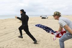 Antifa Little Girl Masked as a Thug Runs Away From MAGA marcher with flag