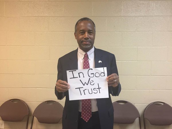 Ben Carson with In God We Trust Sign