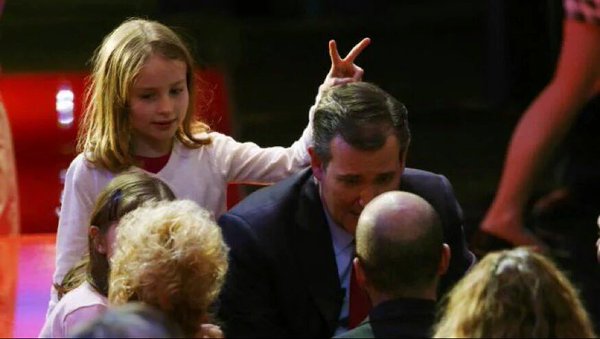 Ted Cruz with daughter making horns over his head